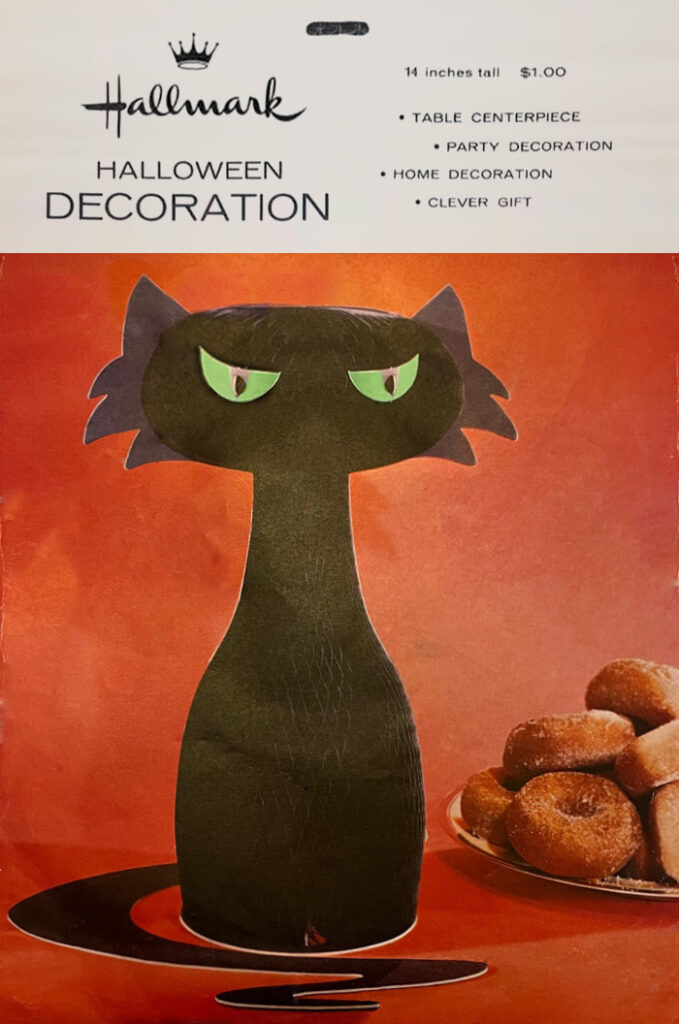 Retro fab sixties black cat with green eyes (next to a plate of donuts), is a Hallmark vintage Halloween collectible from the 1960's. (Envelope identification guide by The Halloween Retrospect archive library).