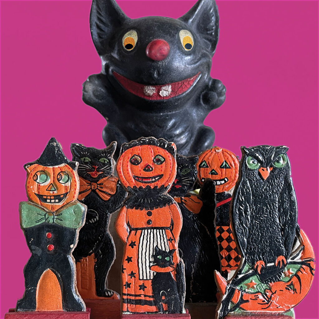 Vintage Halloween collectibles guide photograph with archive library research into old candy containers, decor, and games - currently features these German embossed black cats, owl, and pumpkin-head people on wood-base stands that were sold by suppliers under various labels including skittles, table accessories, or basic novelties like cake decor for parties. (See more in The Halloween Retrospect, Volume 2).
