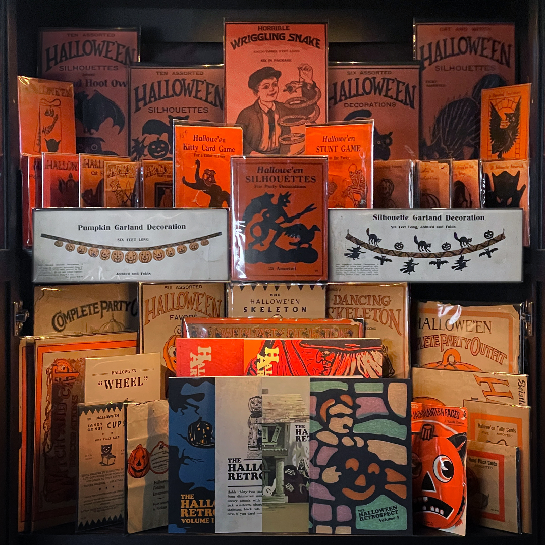 A vintage Halloween collection for the holiday collector featuring multiple packages of Beistle paper ephemera and six guide book references of catalog data from the publishing venture of archive library The Halloween Retrospect.
